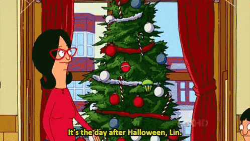 A Bob's Burgers scene with a Christmas tree set up and text that reads "It's the day after Halloween, Lin."